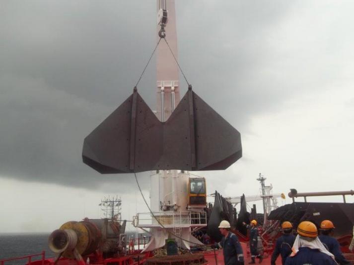 World Carrier - Laying down the spread mooring anchors and chains